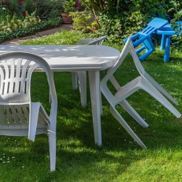 Plastic garden furniture on grass